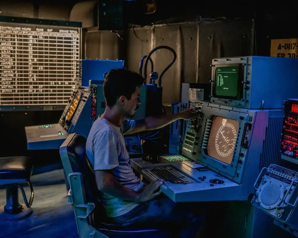 man sitting in front of computer